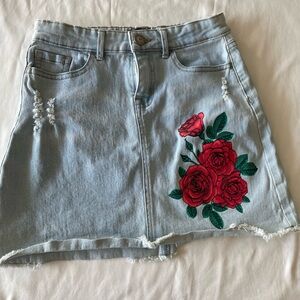 Used light blue Jean skirt with Red Roses